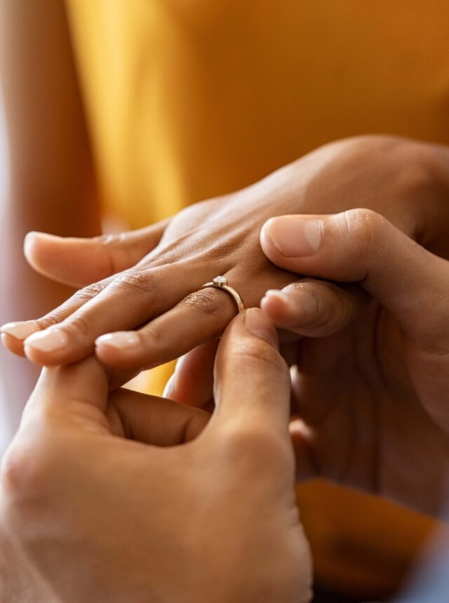 Woman's hand with engagement ring on it